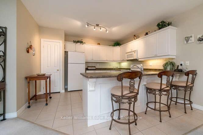 Photo 10 of Unit 309, 1998 Ironstone Drive NE, Burlington, Uptown — HOMEH