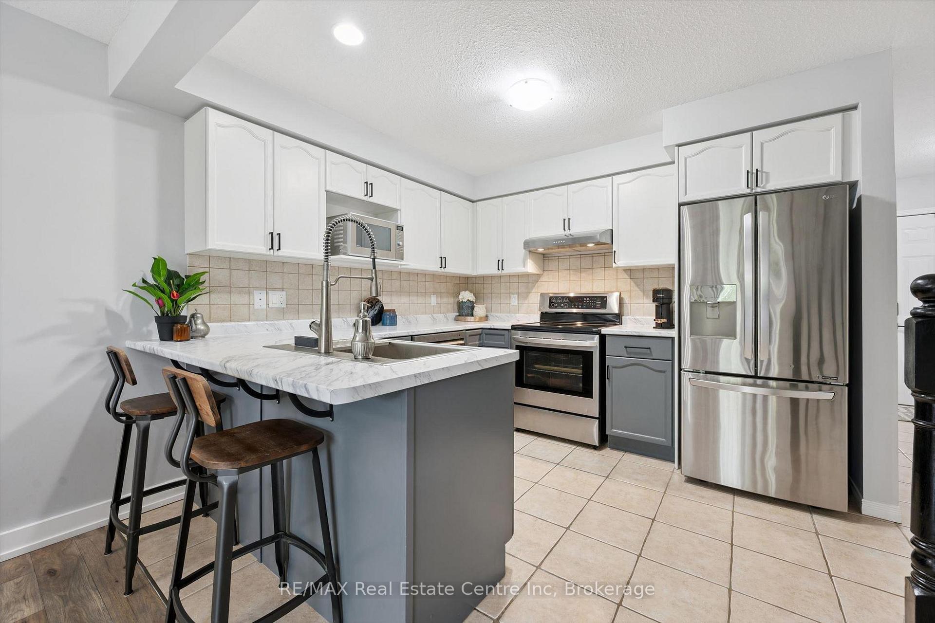 Photo 6 of Unit 21, 31 Schroder Crescent, Guelph, Grange Road — HOMEH