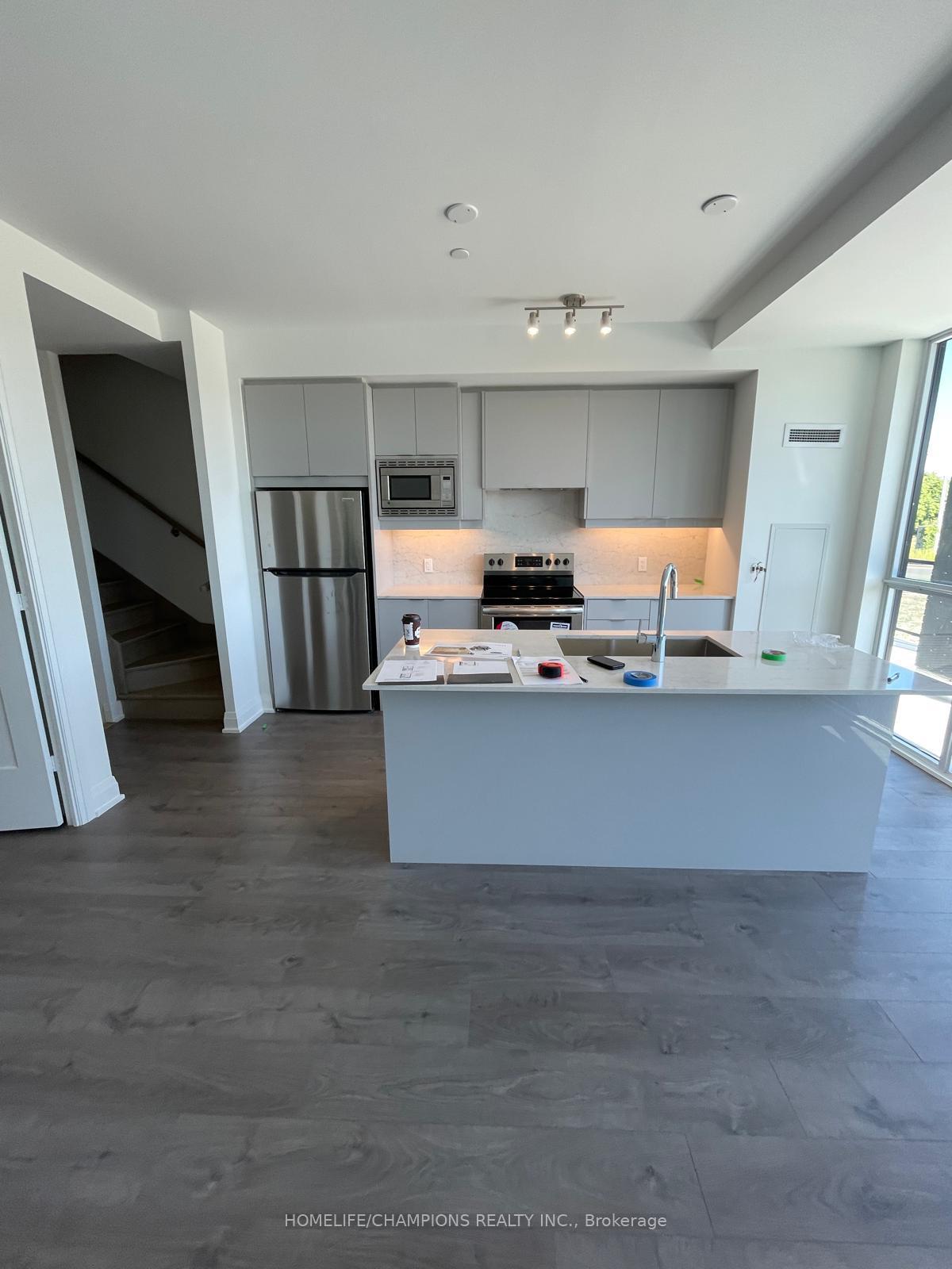 Photo 3 of Unit 5, 60 George Butchart Drive, North York, Downsview-Roding-CFB — HOMEH