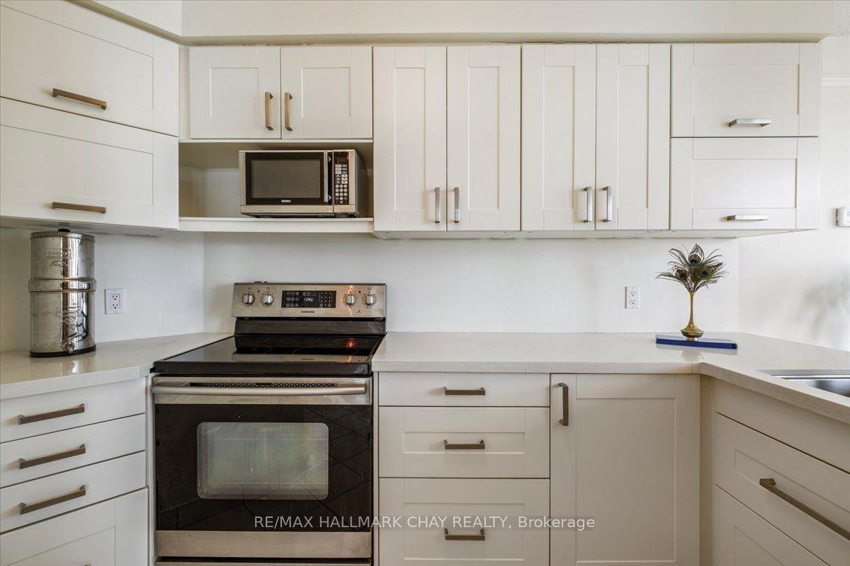 Photo 12 of Unit 407, 140 Dunlop Street E, Barrie, Lakeshore — HOMEH