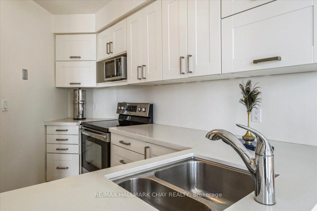 Photo 16 of Unit 407, 140 Dunlop Street E, Barrie, Lakeshore — HOMEH