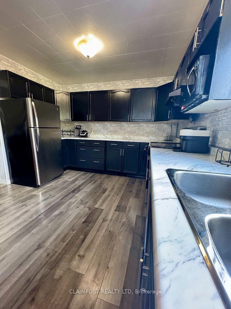Photo 4 of 118 Columbus Avenue, Timmins, TS - SW — HOMEH