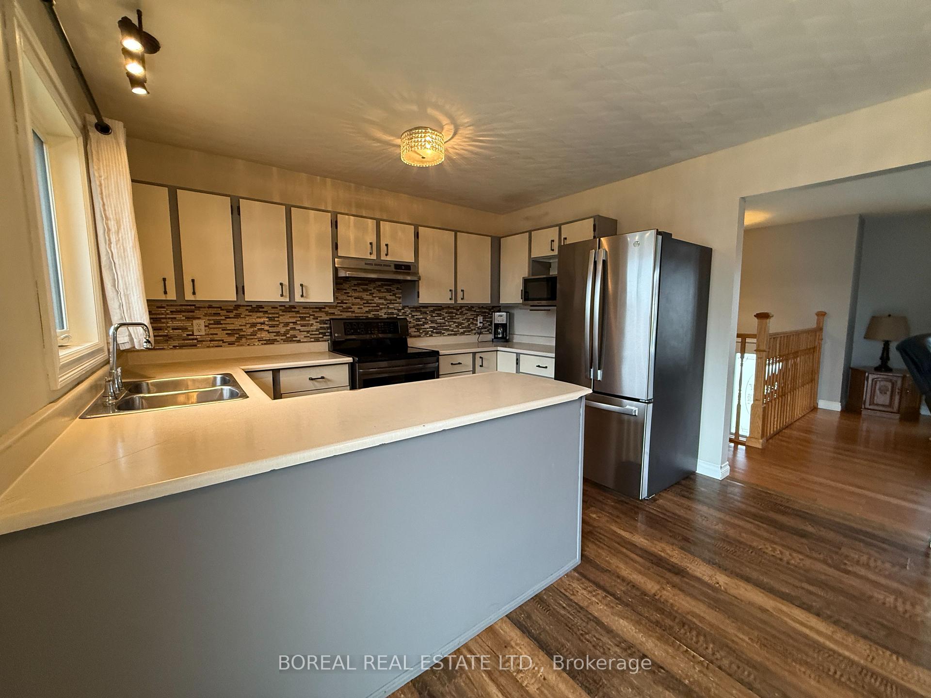 Photo 21 of 30 Eighteenth Avenue, Cochrane — HOMEH