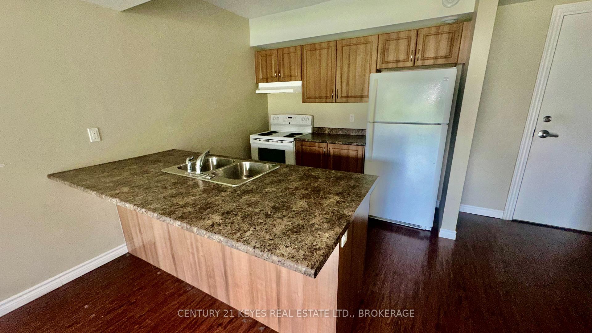 Photo 4 of Unit 101, 665 King Street W, Gananoque, Gananoque — HOMEH