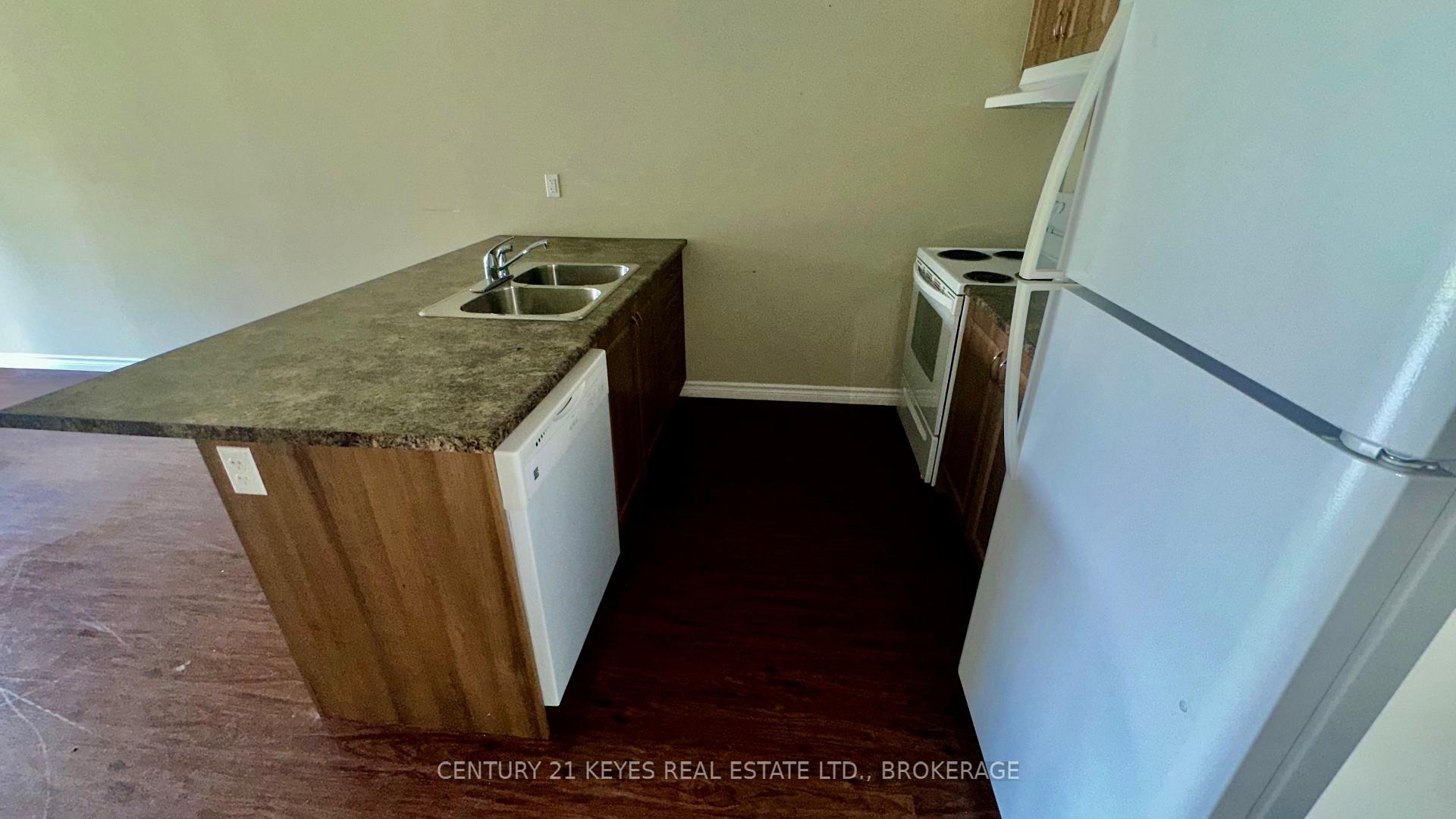 Photo 6 of Unit 101, 665 King Street W, Gananoque, Gananoque — HOMEH