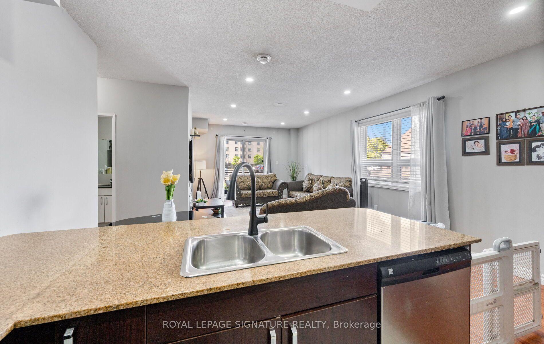 Photo 8 of Unit 104, 7405 Goreway Drive, Mississauga, Malton — HOMEH
