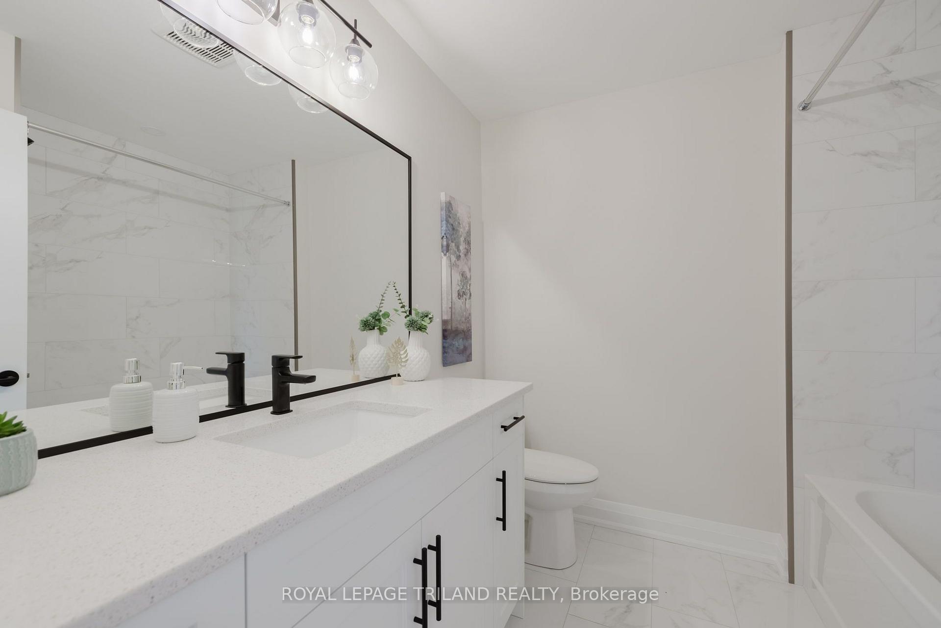 Photo 35 of 1899 Dalmagarry Road, London, North E — HOMEH
