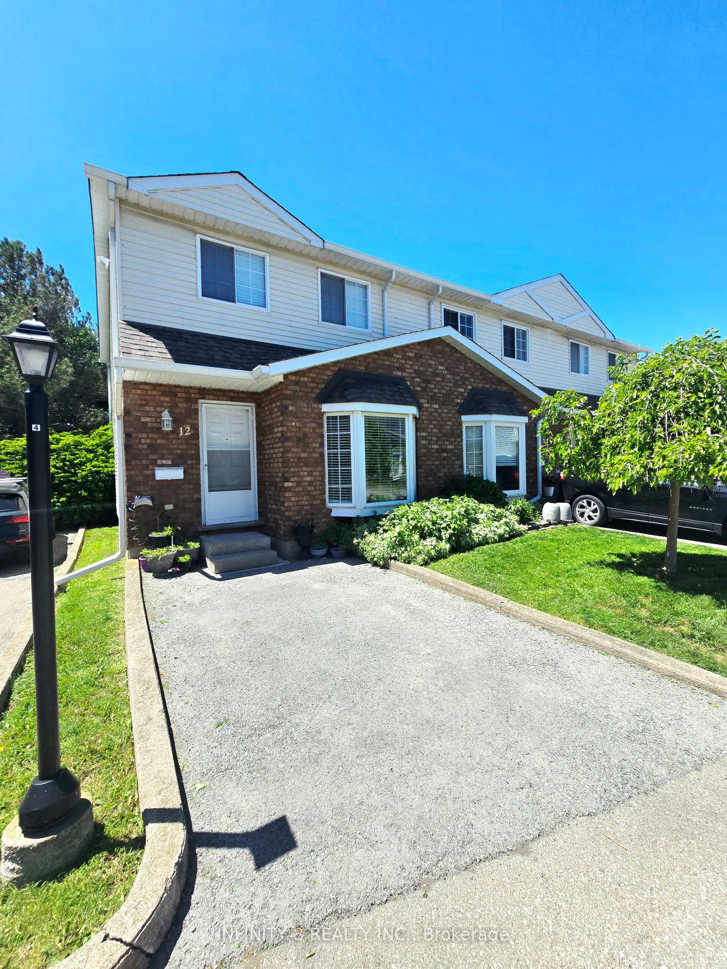 Photo 2 of Unit 12, 6910 Kalar Road, Niagara Falls, West Wood — HOMEH