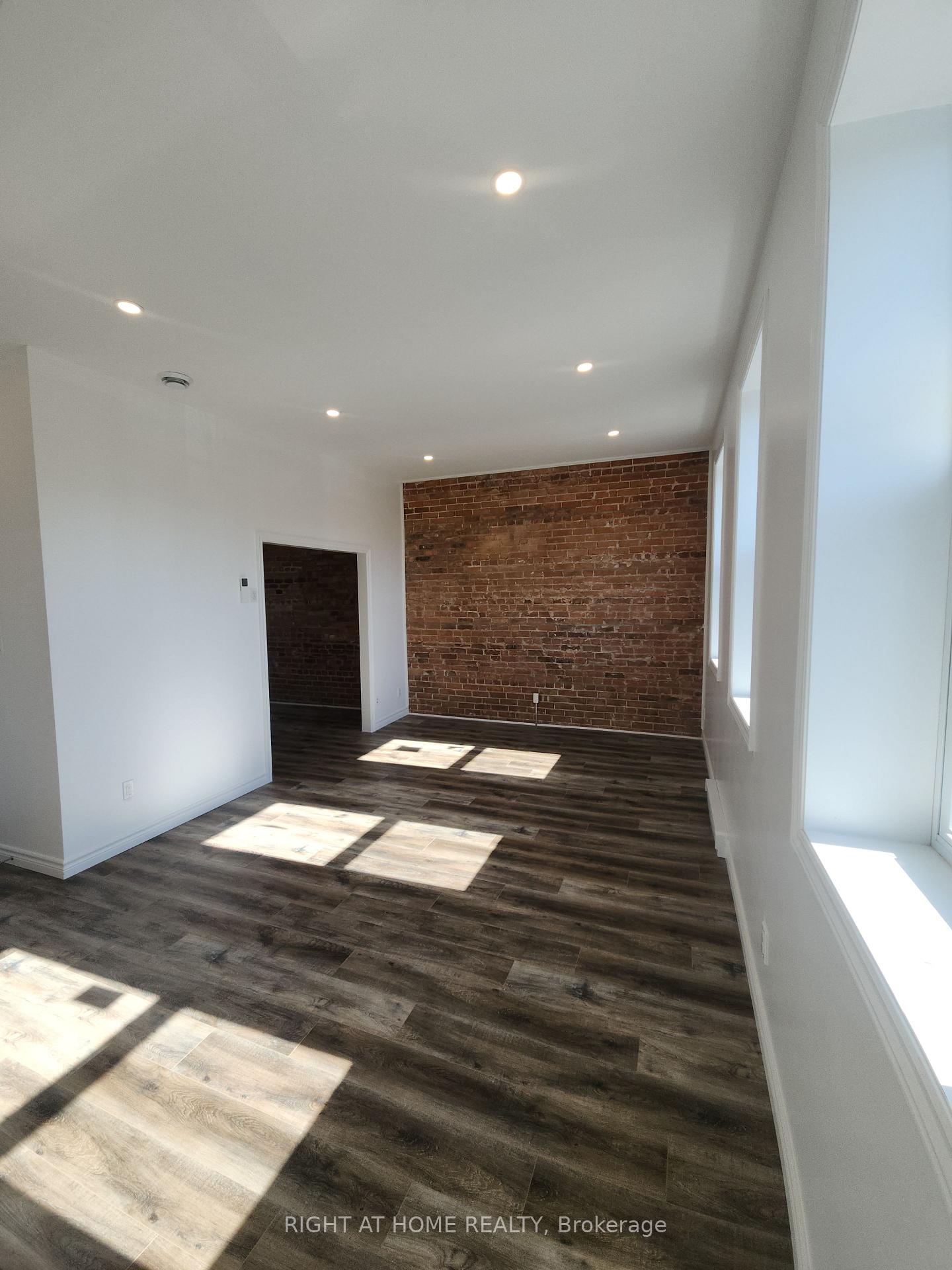 Photo 3 of Unit 201, 9 Queen Street W, Springwater, Elmvale — HOMEH