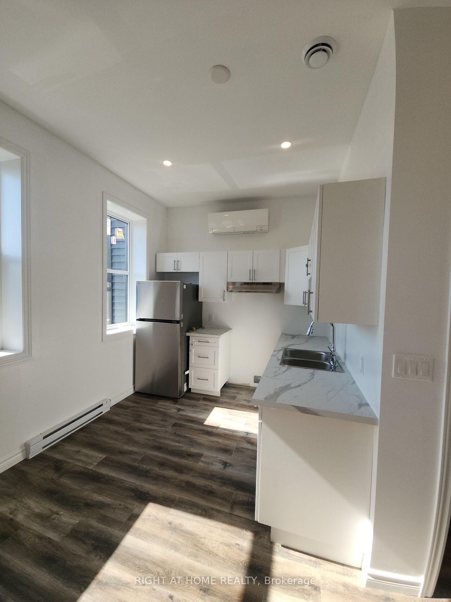 Photo 5 of Unit 201, 9 Queen Street W, Springwater, Elmvale — HOMEH