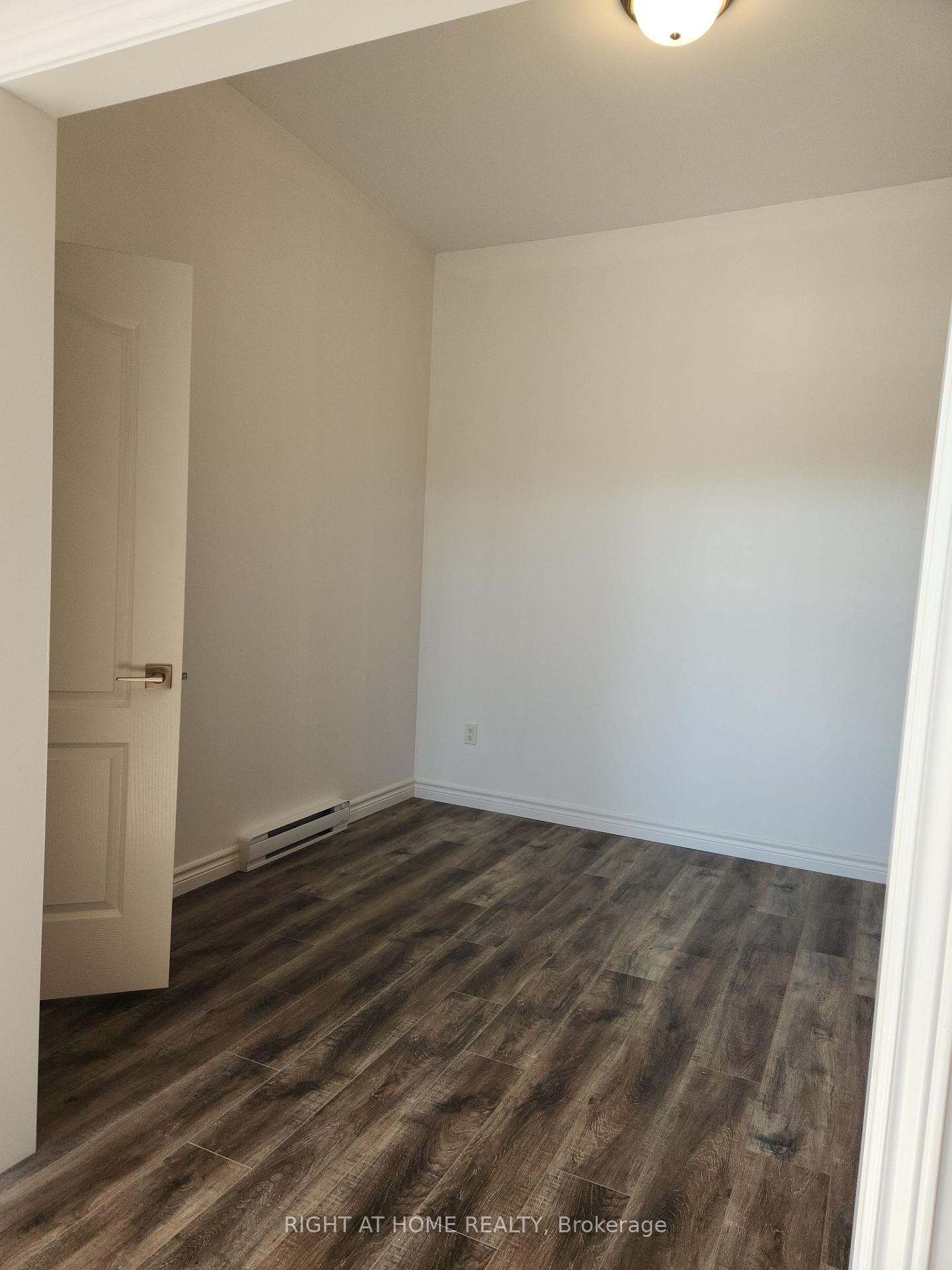 Photo 7 of Unit 201, 9 Queen Street W, Springwater, Elmvale — HOMEH