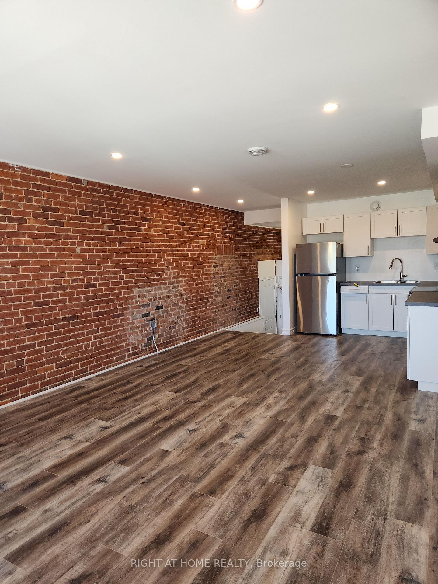 Photo 4 of Unit 203, 9 Queen Street W, Springwater, Elmvale — HOMEH