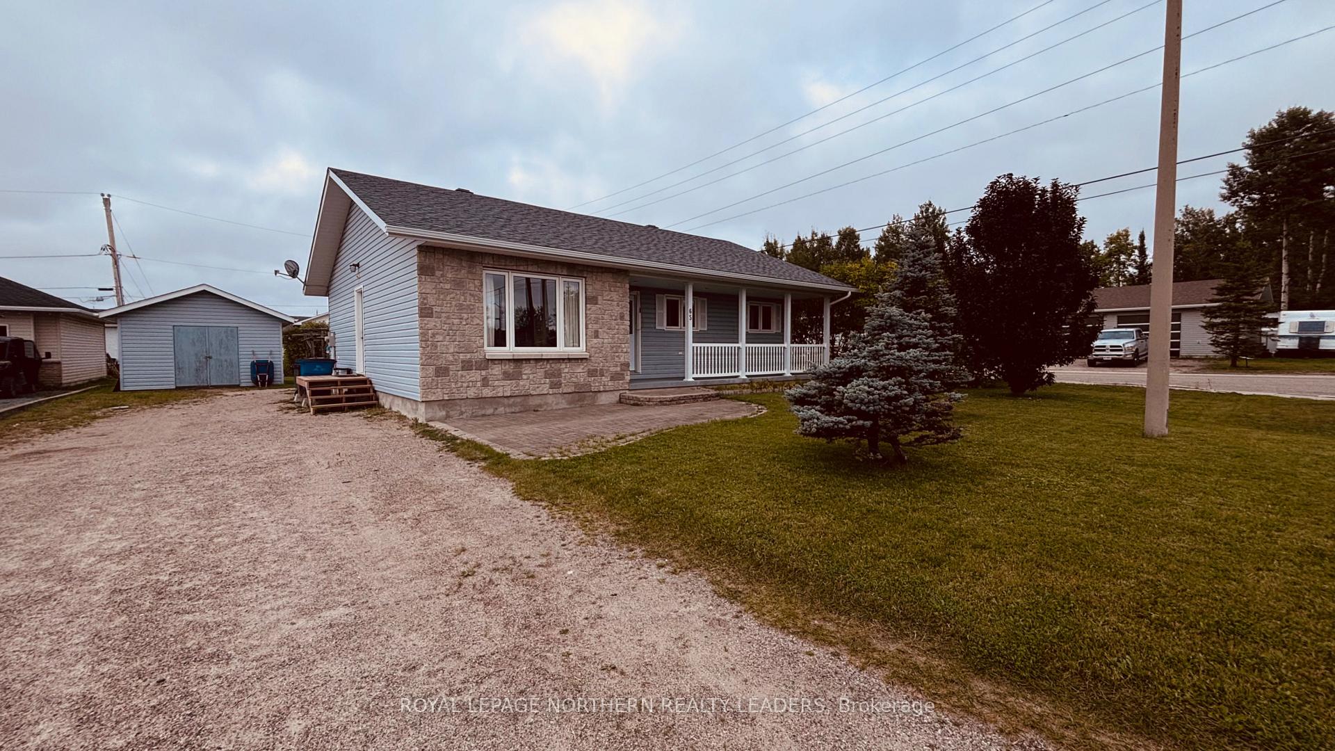 Photo 1 of 65 Connaught Avenue S, Cochrane — HOMEH