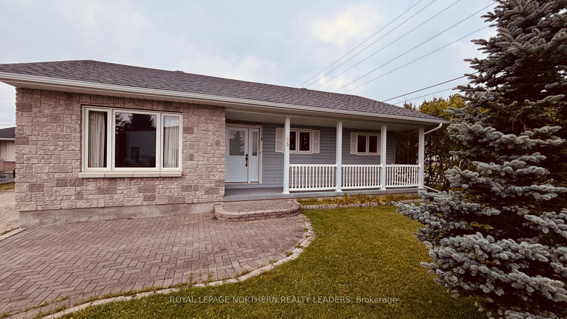Photo 2 of 65 Connaught Avenue S, Cochrane — HOMEH