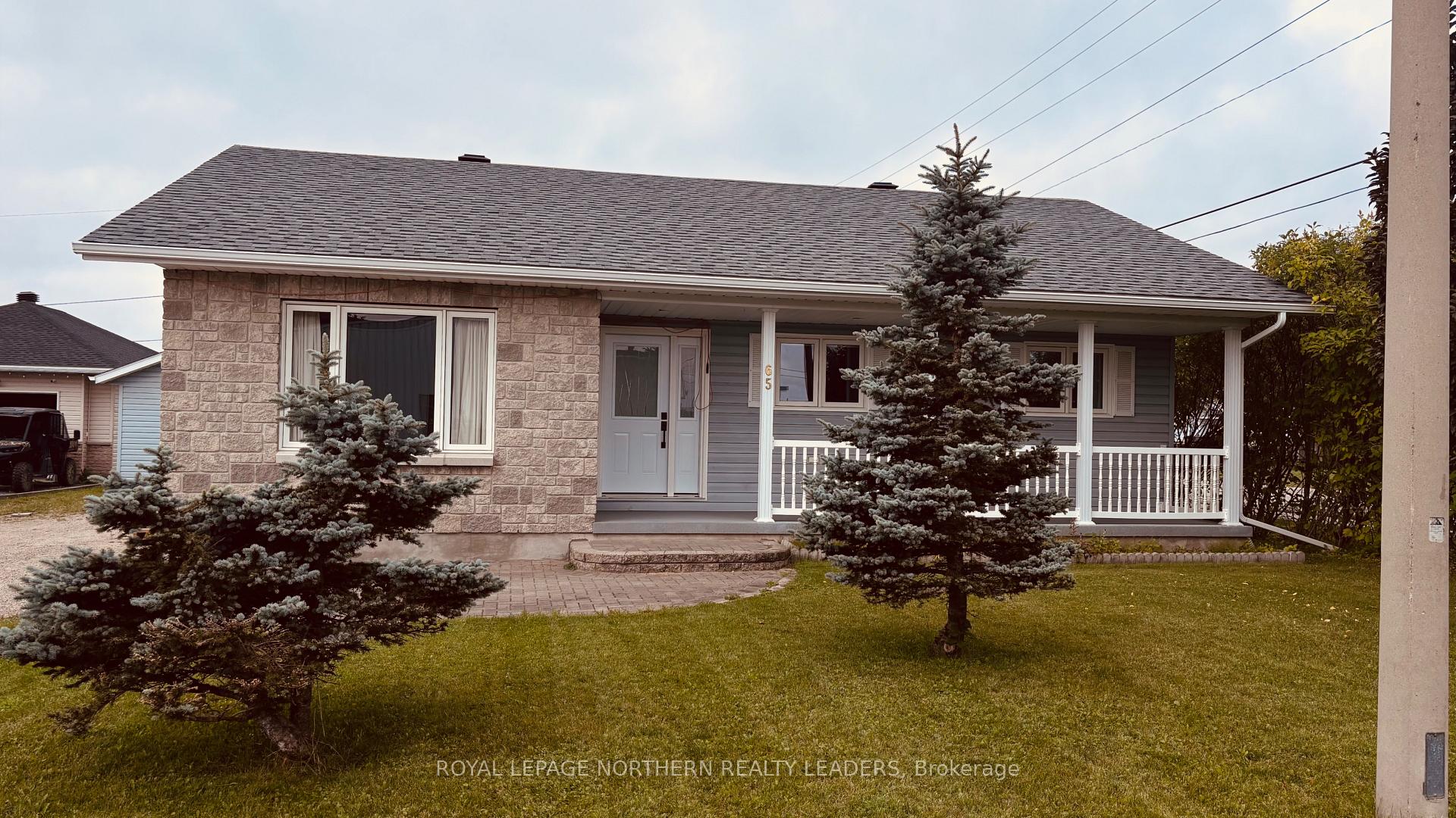 Photo 3 of 65 Connaught Avenue S, Cochrane — HOMEH
