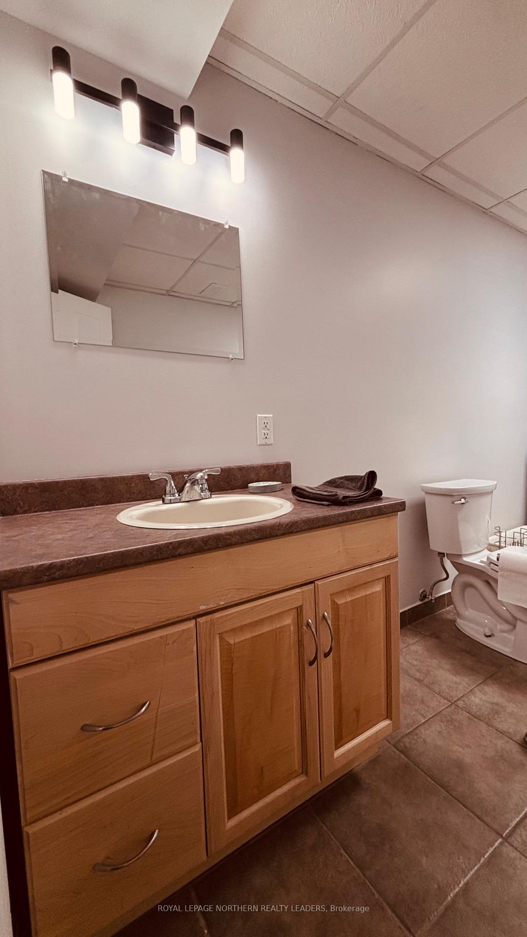 Photo 34 of 65 Connaught Avenue S, Cochrane — HOMEH