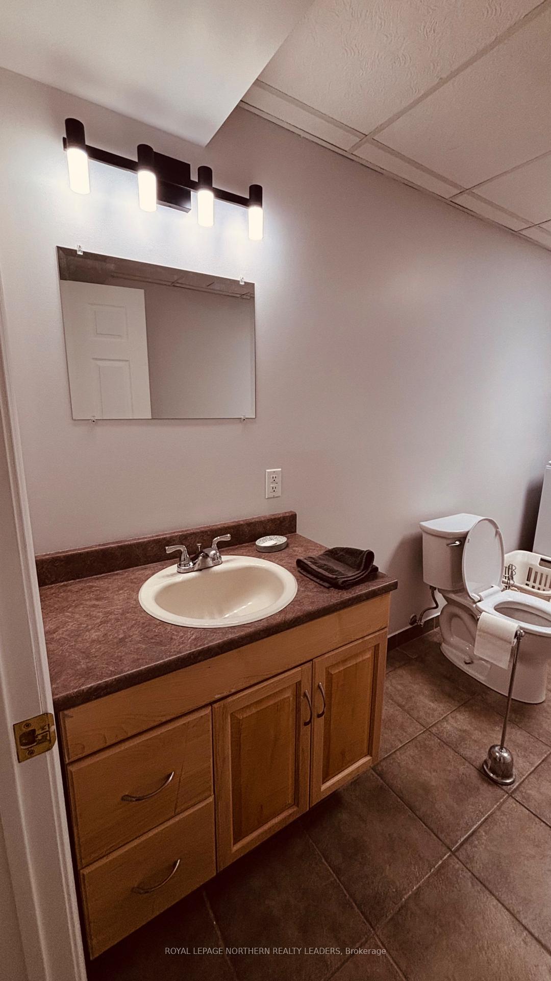 Photo 35 of 65 Connaught Avenue S, Cochrane — HOMEH