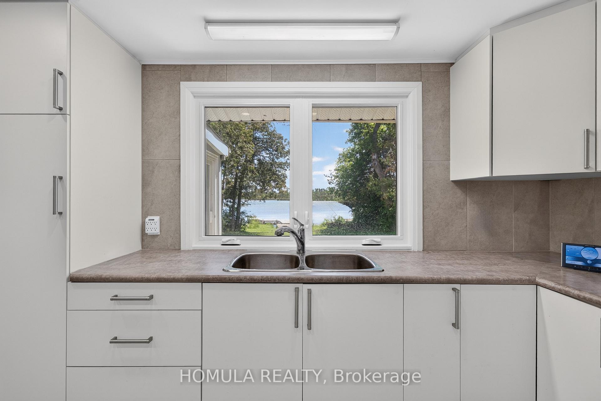 Photo 18 of 24 Riverside Drive, Kawartha Lakes, Ops — HOMEH