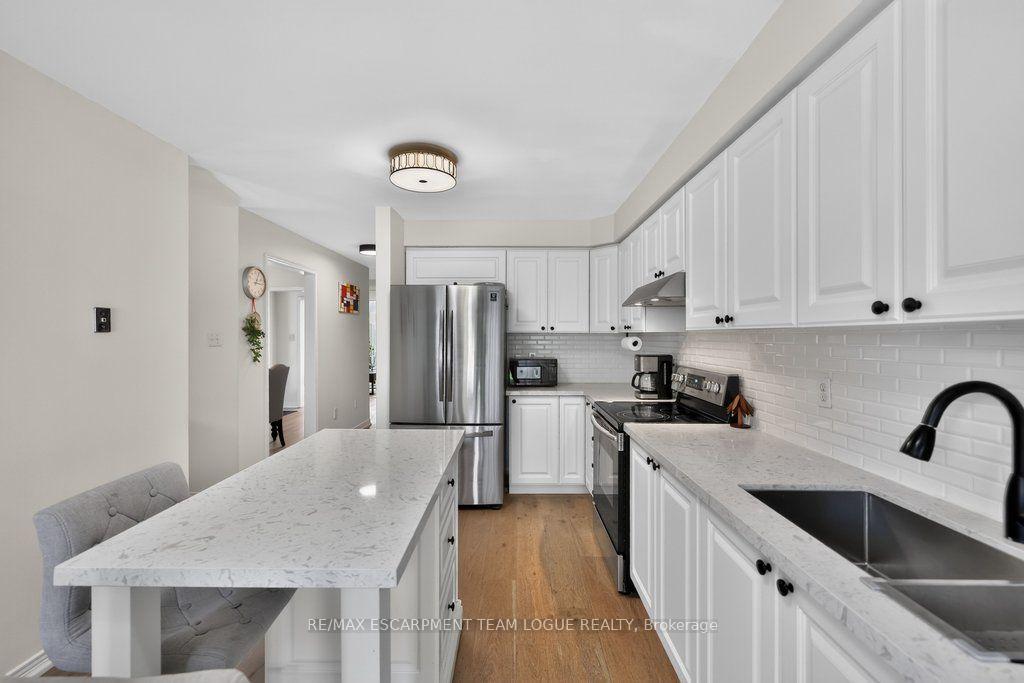 Photo 12 of Unit 9, 2103 Berwick Drive, Burlington, Rose — HOMEH