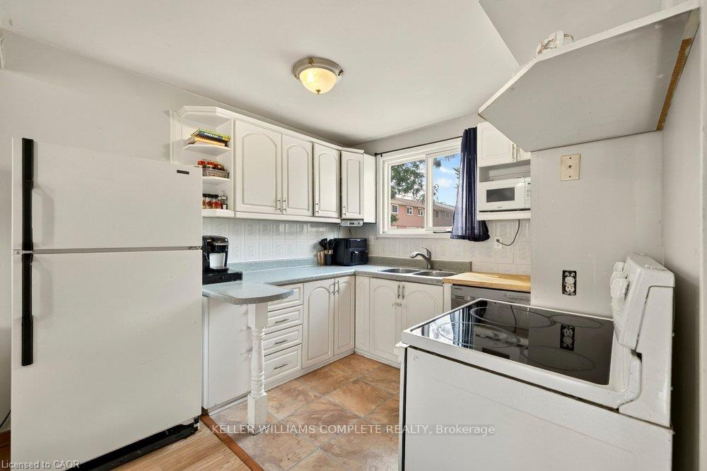 Photo 11 of Unit 14, 120 Quigley Road, Hamilton, Vincent — HOMEH