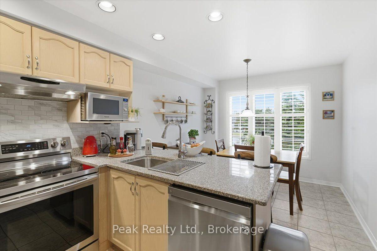 Photo 8 of Unit 102, 9800 Mclaughlin Road N, Brampton, Fletcher's Creek Village — HOMEH