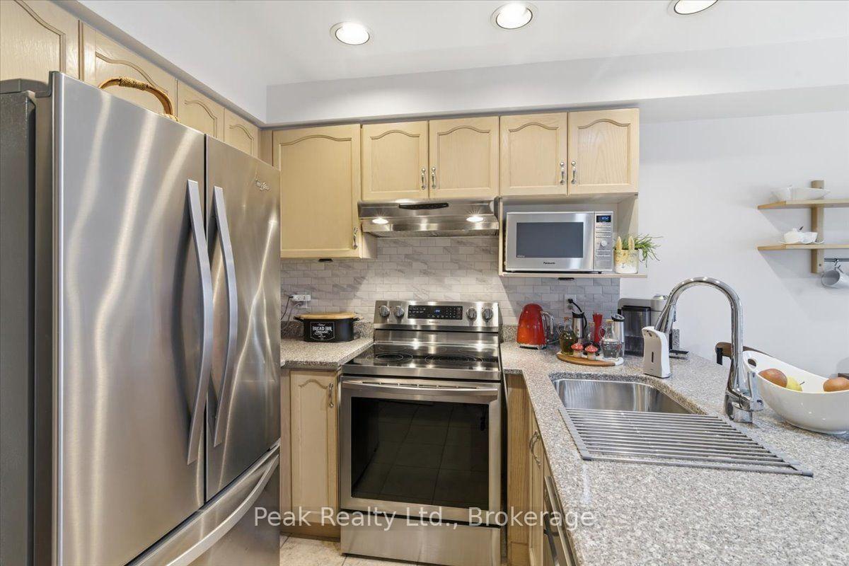 Photo 9 of Unit 102, 9800 Mclaughlin Road N, Brampton, Fletcher's Creek Village — HOMEH