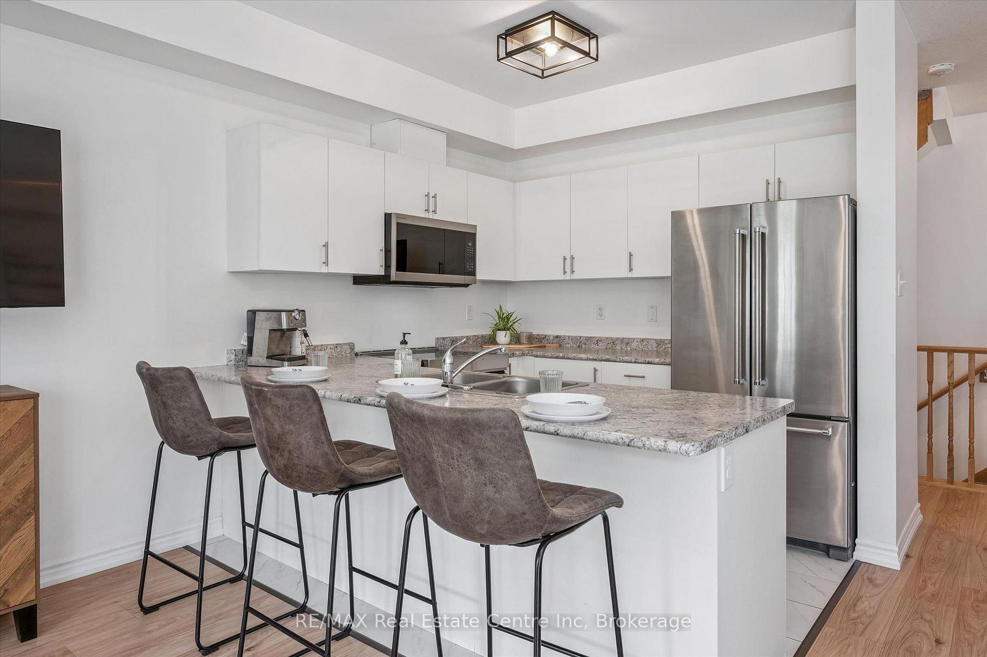 Photo 5 of Unit 30, 88 Decorso Drive, Guelph, Kortright East — HOMEH