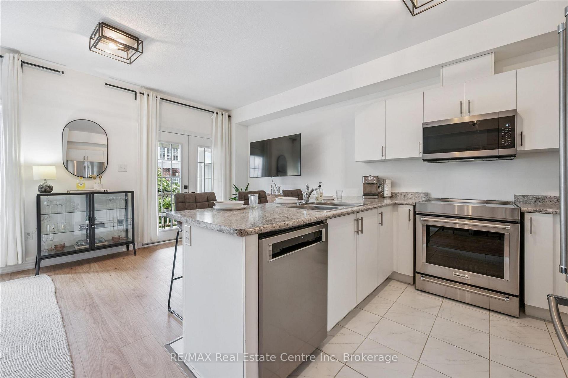 Photo 6 of Unit 30, 88 Decorso Drive, Guelph, Kortright East — HOMEH