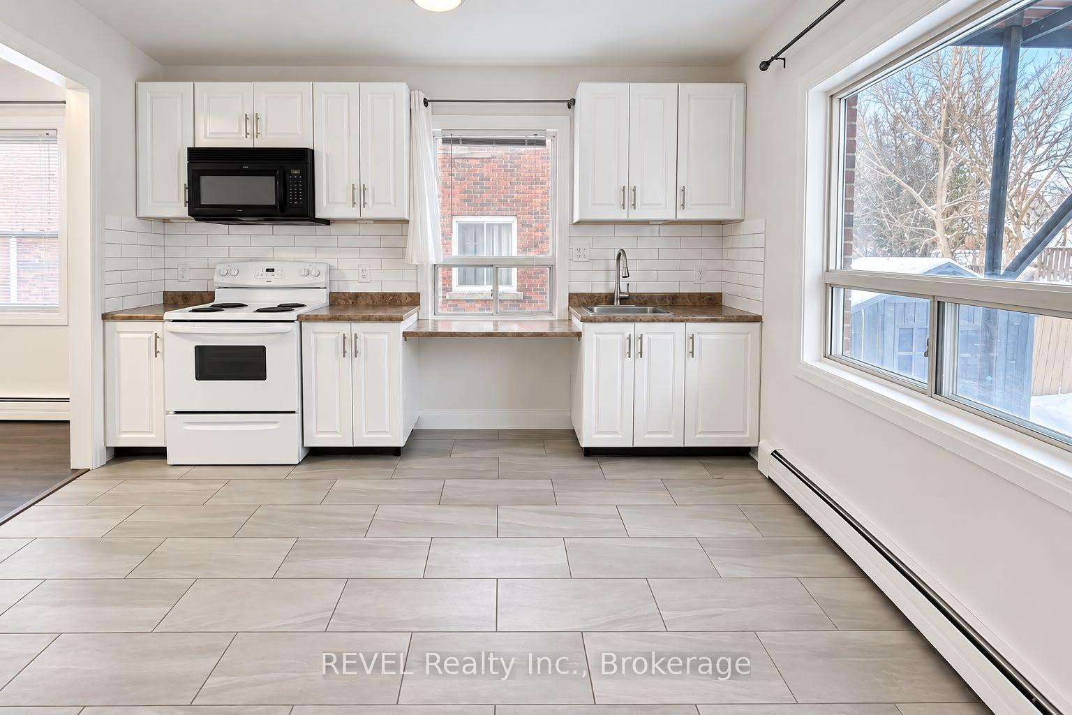 Photo 3 of Unit 1, 5459 Ontario Avenue, Niagara Falls, Downtown — HOMEH