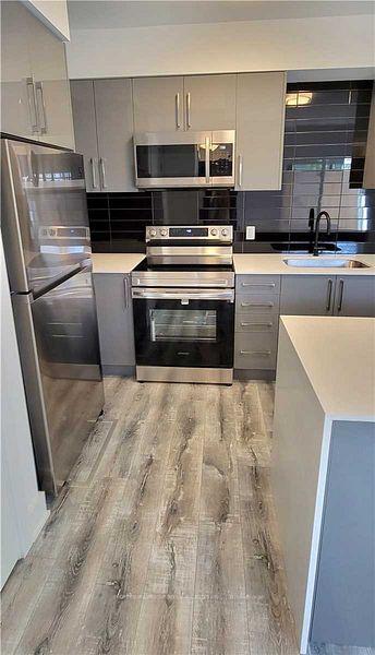 Photo 2 of Unit 102, 6065 McLEOD Road, Niagara Falls, Arad/Fallsview — HOMEH