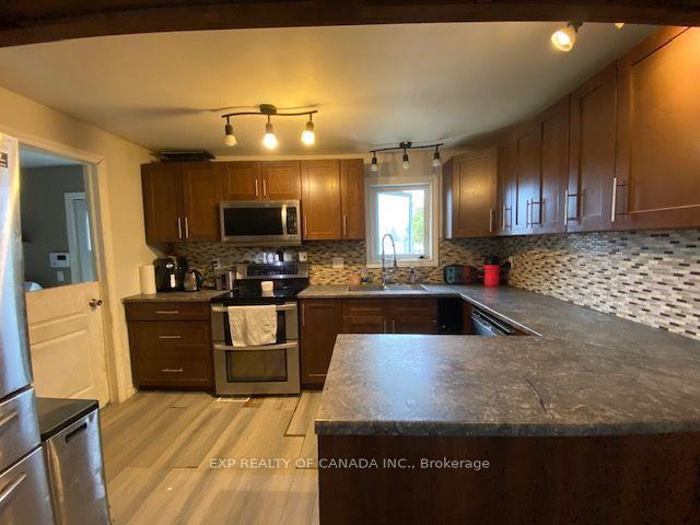 Photo 4 of 167 13th Avenue, Cochrane — HOMEH