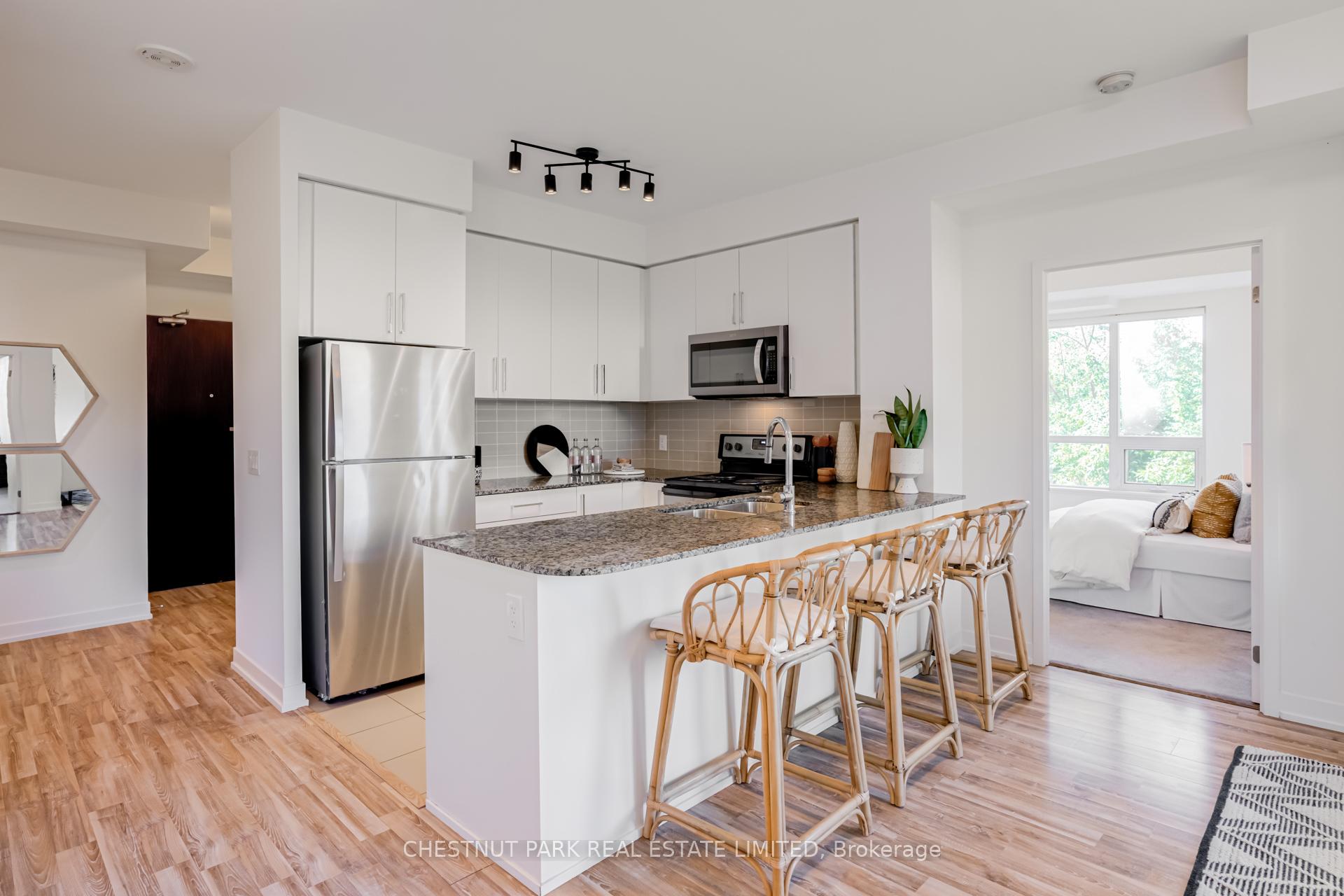 Front of Unit 205, 840 Queens Plate Drive