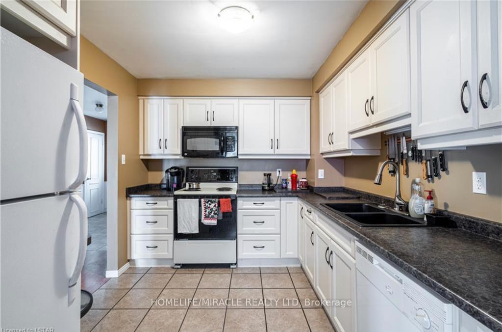 Photo 7 of Unit 12, 669 Osgoode Drive, London, South Y — HOMEH