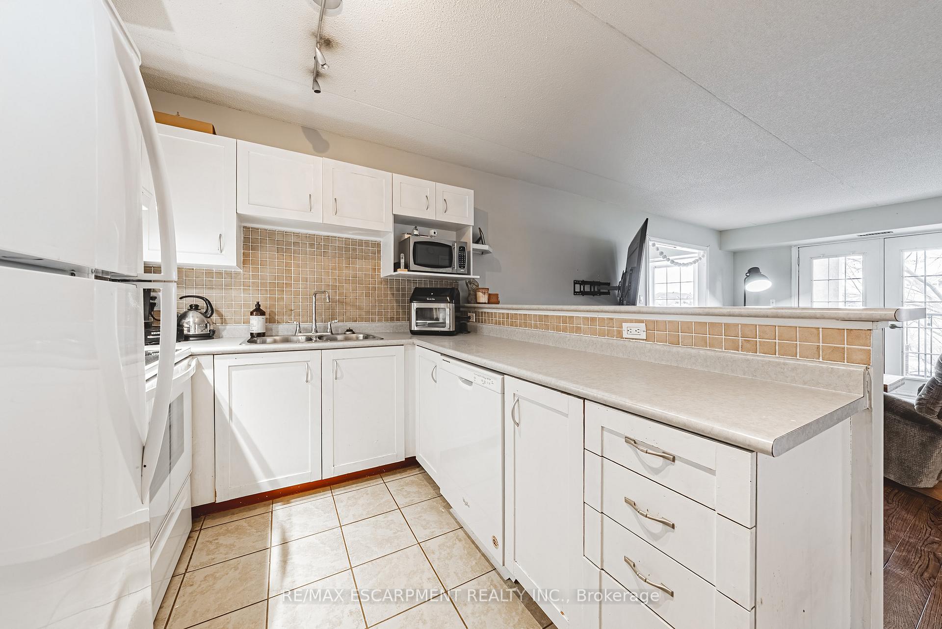 Photo 8 of Unit 313, 1451 Walkers Line, Burlington, Tansley — HOMEH