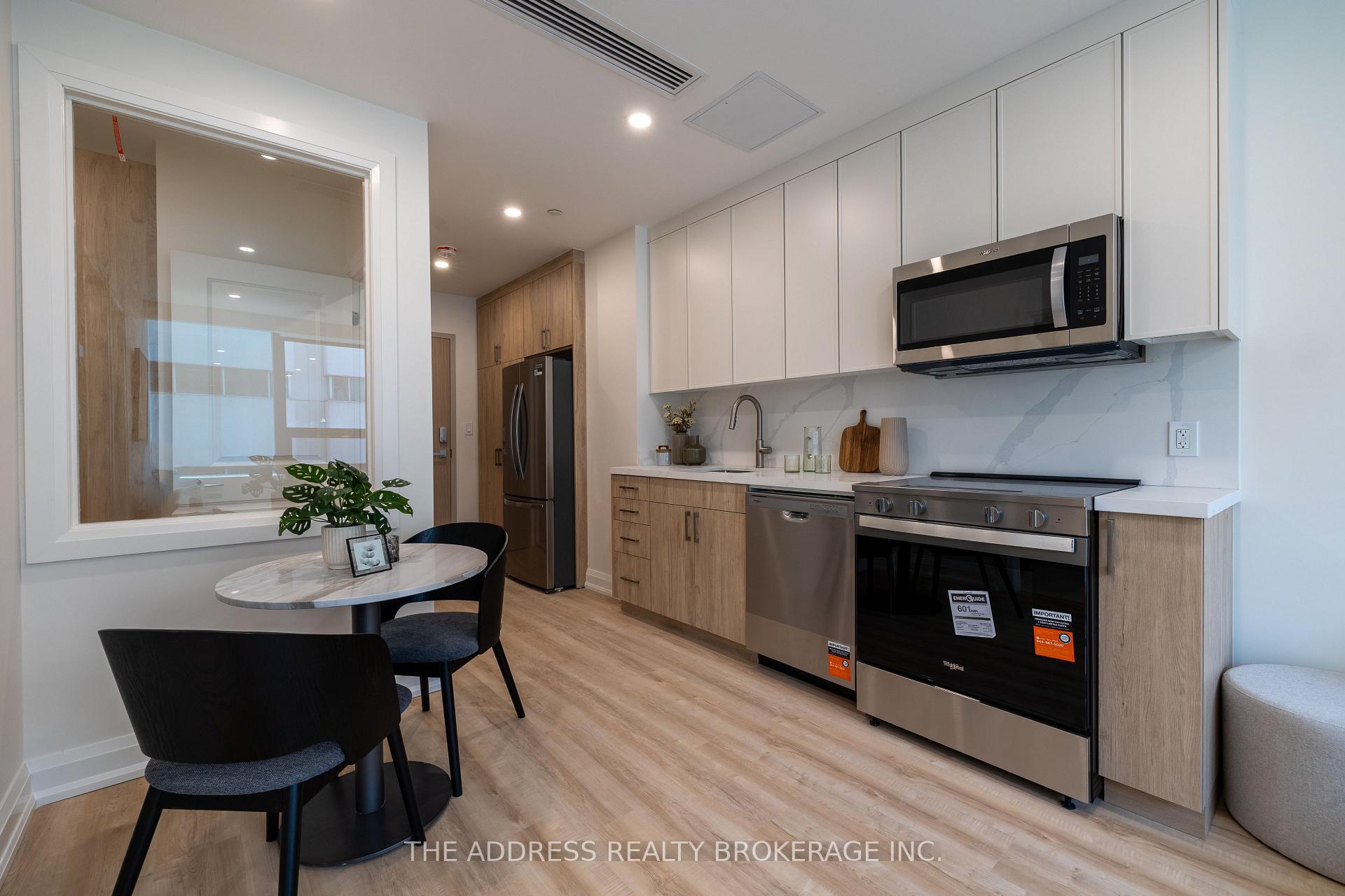 Photo 5 of Unit 409, 40 King Street W, Oshawa, Central — HOMEH