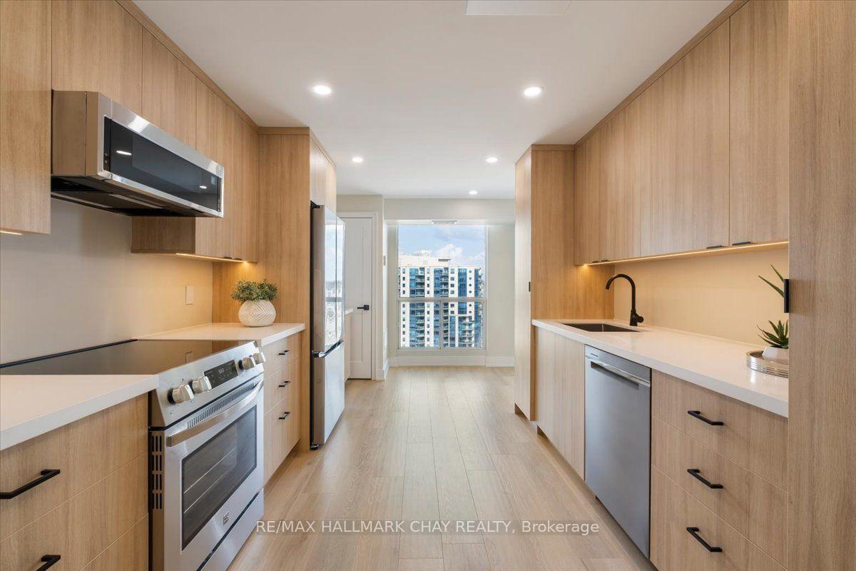 Photo 6 of Unit 1402, 65 Ellen Street, Barrie, Lakeshore — HOMEH