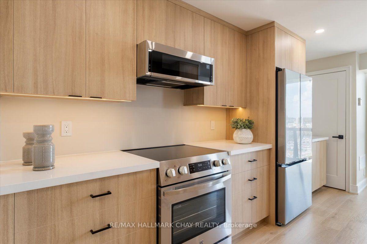 Photo 7 of Unit 1402, 65 Ellen Street, Barrie, Lakeshore — HOMEH