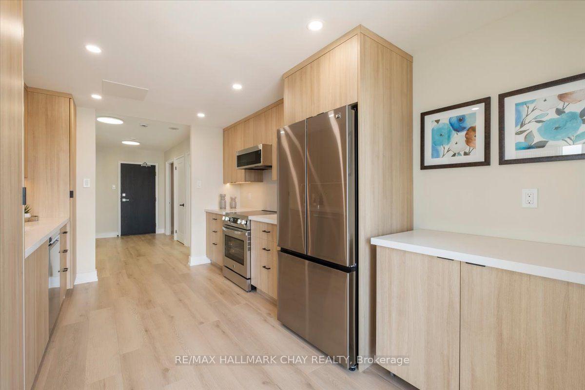 Photo 10 of Unit 1402, 65 Ellen Street, Barrie, Lakeshore — HOMEH