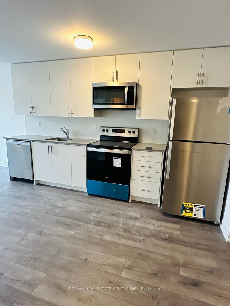 Photo 7 of Unit 410, 3401 Ridgeway Drive, Mississauga, Erin Mills — HOMEH