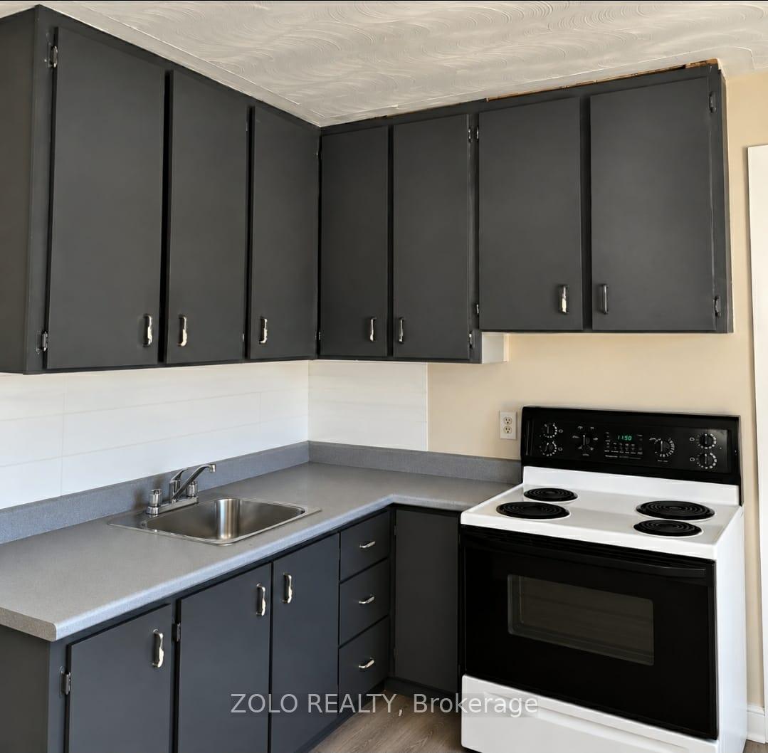 Photo 3 of Unit Upper unit, 309 Cedar Street N, Timmins, TNE - Central — HOMEH