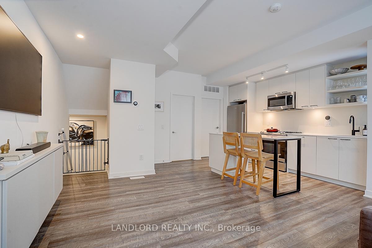 Photo 5 of Unit TH13, 30 Ed Clark Gardens, Toronto, Weston-Pellam Park — HOMEH