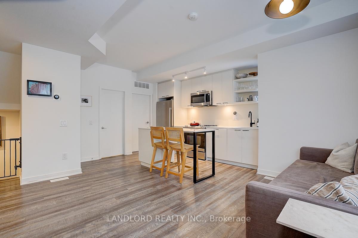 Photo 6 of Unit TH13, 30 Ed Clark Gardens, Toronto, Weston-Pellam Park — HOMEH