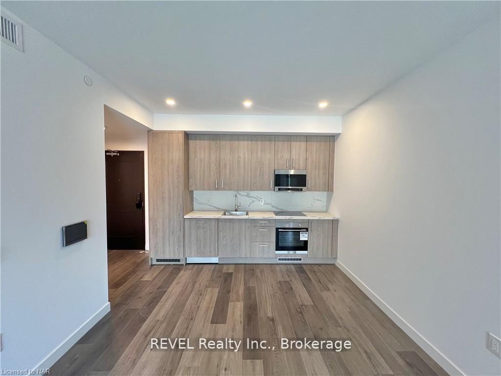 Photo 4 of Unit 213, 7549 Kalar Road, Niagara Falls, Brown — HOMEH