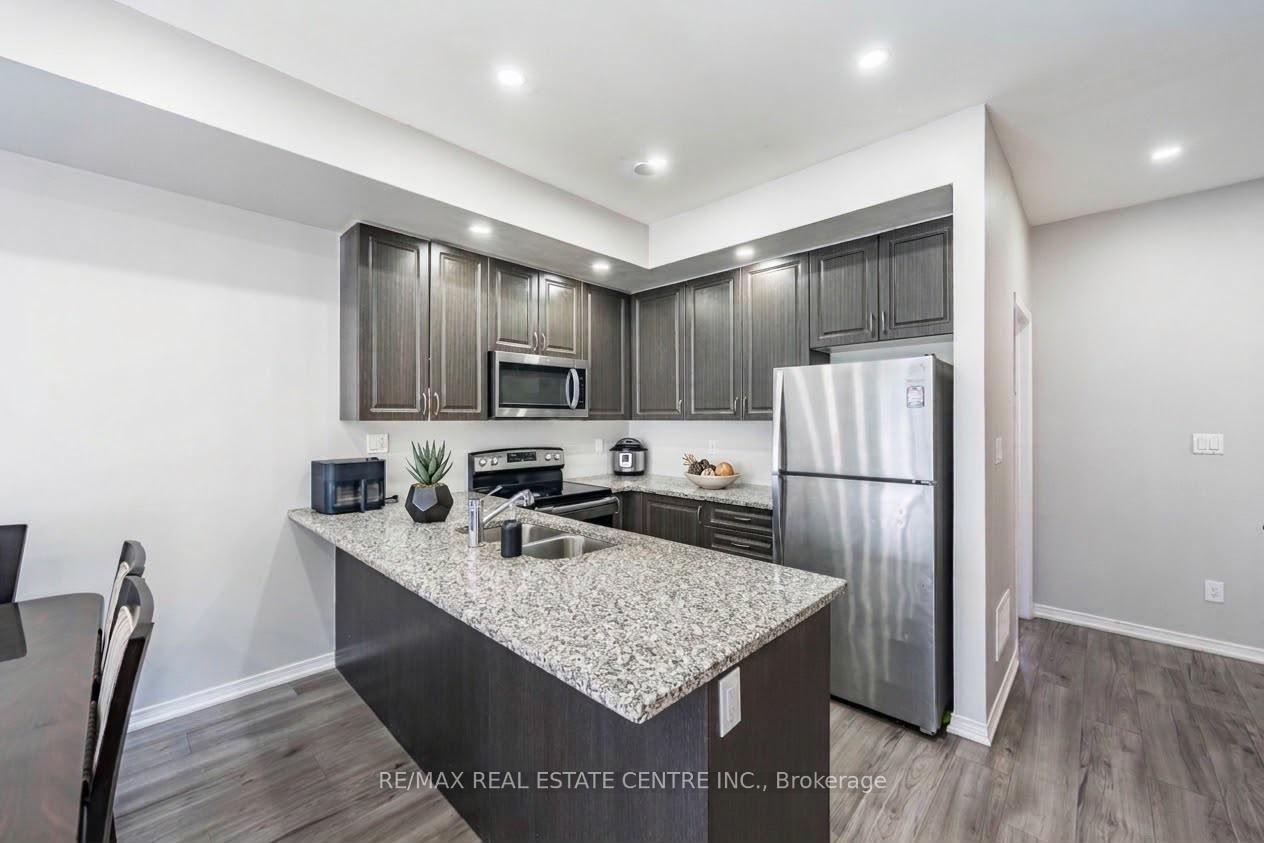 Photo 5 of Unit 95, 91 Danzatore Path, Oshawa, Windfields — HOMEH