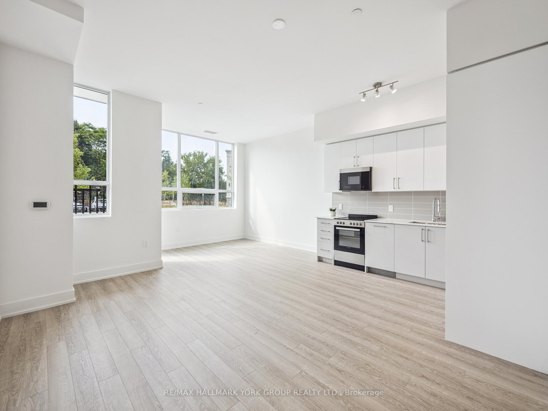 Photo 5 of Unit 104, 2075 King Road, King, King City — HOMEH