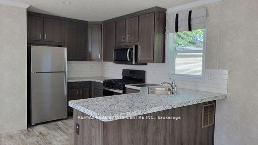 Photo 3 of 24 MacPherson Crescent, Hamilton, Rural Flamborough — HOMEH