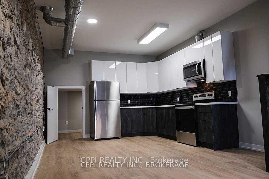 Photo 2 of Unit 103, 140 Simcoe Street, Peterborough, Town Ward 3 — HOMEH