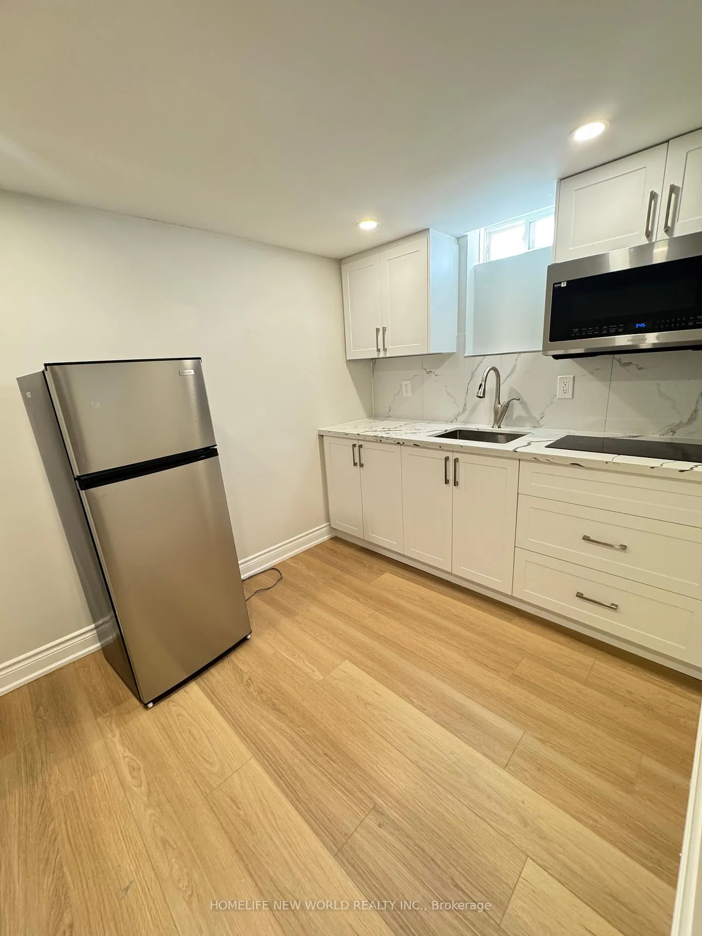 Photo 5 of Unit Bsmt 1, 90 Riverwalk Drive, Markham, Box Grove — HOMEH