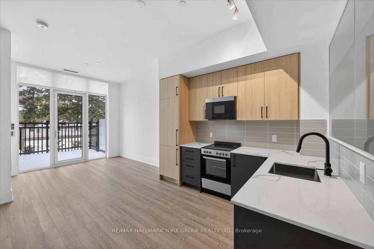 Photo 5 of Unit 112, 2075 King Road, King, King City — HOMEH