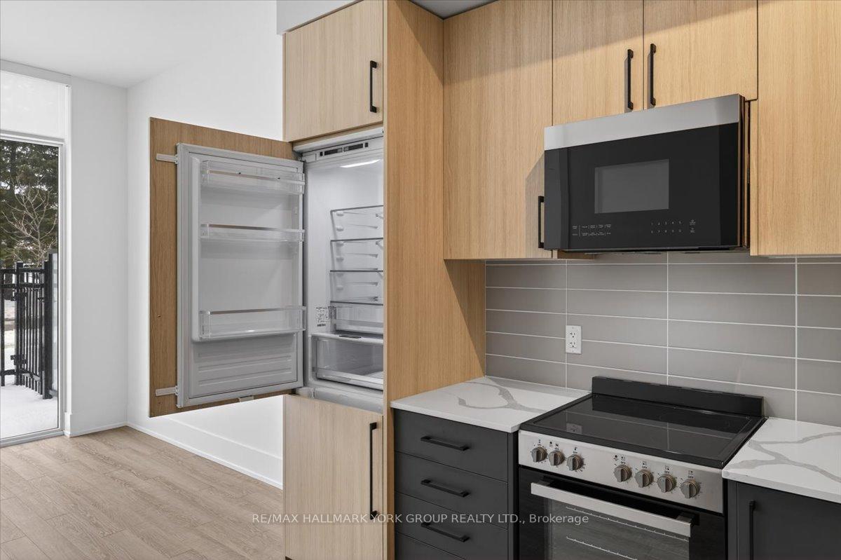Photo 7 of Unit 112, 2075 King Road, King, King City — HOMEH